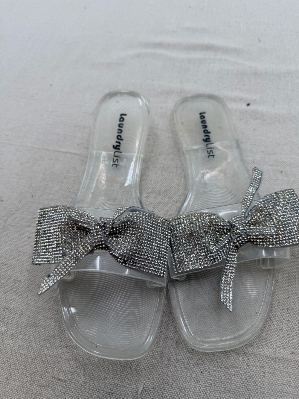 Laundry List Clear Slide Sandals with Silver Bow